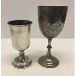 A large Elkington silver plated goblet together with a smaller silver plated cup.