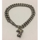 Heavyweight silver chain bracelet with boot charm.