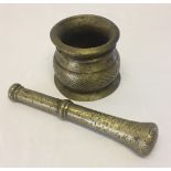 A vintage bronze apothecaries pestle & mortar.