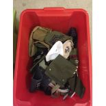 A box of assorted cloth military badges, patches and insignia.