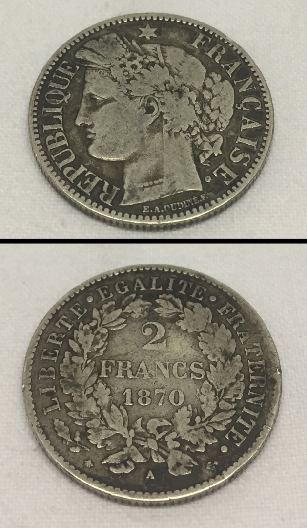 An 1870 silver french 2 franc coin.