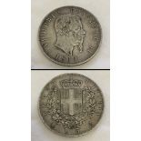 An 1869 Italian 0.900 silver 5 lire coin.