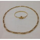 A silver gilt bracelet with Claddagh design, together with a gold plated link chain necklace.