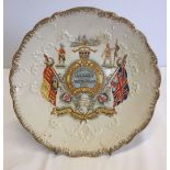 A Boer War commemorative ceramic plate. Reads 'Ready Aye Ready, God save our Queen'.