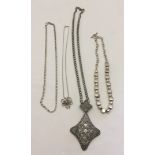 4 white metal necklaces.