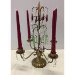 Vintage metal 4 arm candelabra decorated with different coloured crystal chandelier drops.