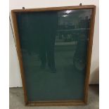 A slim baize lined dealers display cabinet with glass lid.