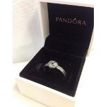 A genuine Pandora "Sparkling Love Knot" ring.