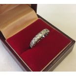 A 9ct gold ladies diamond set full eternity ring (one stone missing).