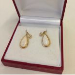 A pair of 9ct gold screw back earrings.