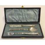 A cased silver plated condiment set of cutlery.