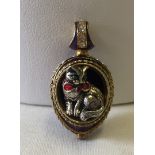 Gold and guilloche enamelled cat pendant.