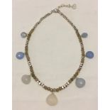 A silver and chalcedony necklace.