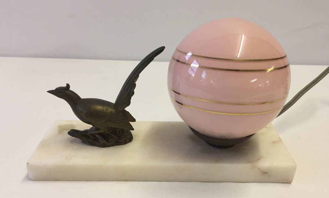 A vintage French marble based desk lamp with circular pink shade and metal pheasant figure.