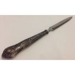 A silver handled letter opener. Hallmarked.