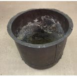 An antique large copper wash tub/log basket with rivetted stud work