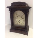 A German 'Kienzle' wooden cased mantle clock.