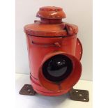 A vintage ship's red port signal lamp.