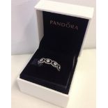 A Pandora "Romance" silver eternity ring.