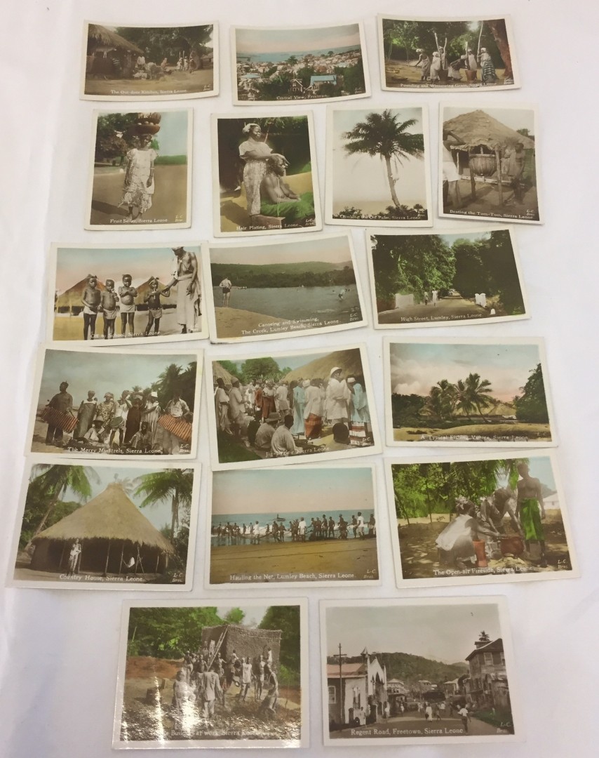 A collection of 18 small c1920-40s coloured photographic cards of tribal scenes in Sierra Leone.