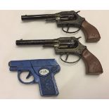 3 c1960's toy cap guns. 2 Lone Star cowboy pistols and a M.I.5 revolver