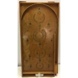 Vintage wooden bagatelle with steel balls