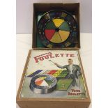 A boxed vintage 'Poolette' games with bakelite wheel.