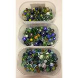 3 tubs of mixed vintage glass marbles.