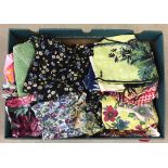 A box of vintage aprons, pinnys and house coats.