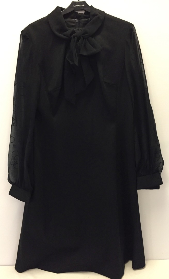 Long sleeved black dress. Linda Leigh.