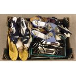 A box of assorted vintage open toed shoes.