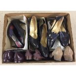 A box of vintage ladies shoes.