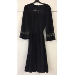 Calf-length black dress sequin beaded black crepe. Norman Linton.