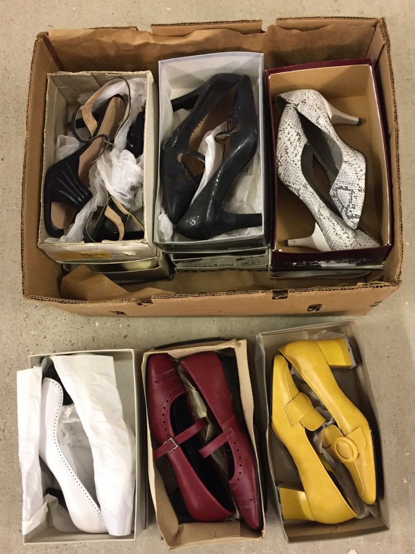 A box of mixed vintage ladies shoes.