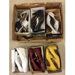 A box of mixed vintage ladies shoes.