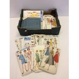 A box of vintage dress making patterns c1950-60s.