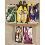 A box of circa 1980s brightly coloured ladies shoes.