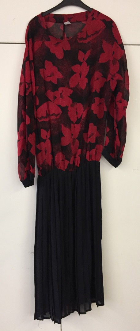 Calf-length dress. Black skirt, red and black top. No label.