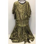 Calf-length gold dress. Gianni Balenti.