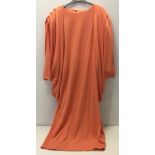 Draped orange jersey dress. No label.