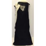 A black velvet evening dress with a black & ivory stole. Atrina