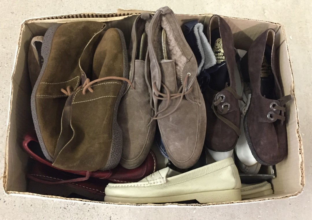 A box of mixed vintage ladies shoes and boots.