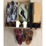 A box containing 12 pairs of vintage ladies Clarks shoes.