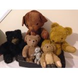 A box of miscellaneous vintage teddy bears.