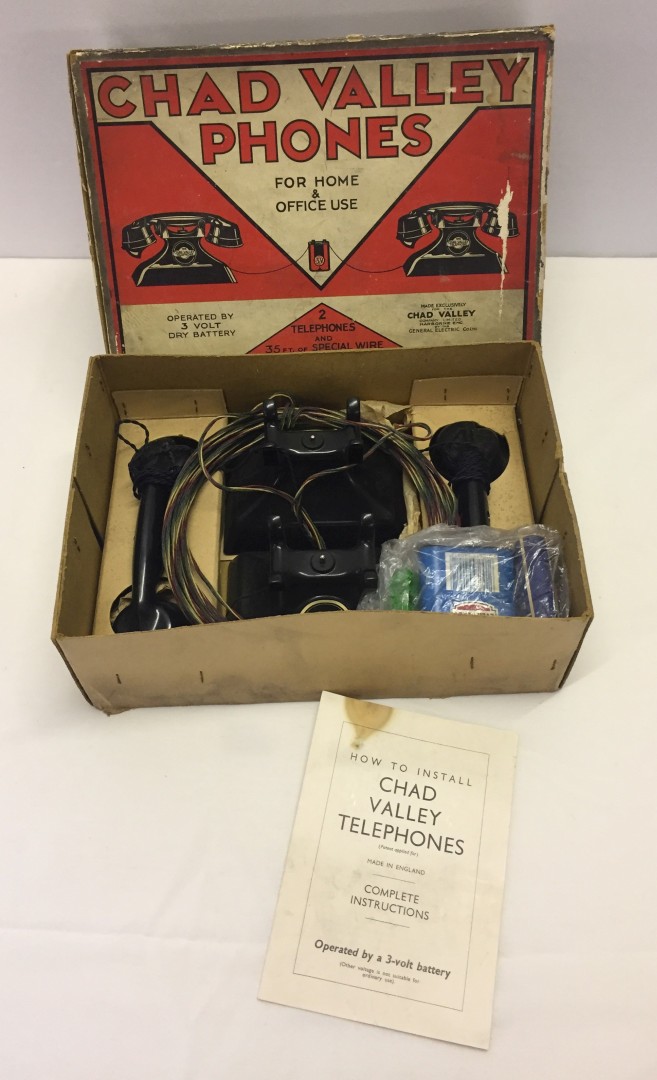 A Chad Valley telephones set in original box.