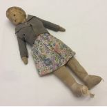 A c1920-30s doll. Ceramic head & soft body.