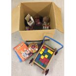 A box of vintage toys & games to include push-along bricks, and a Chad Valley tinplate top.