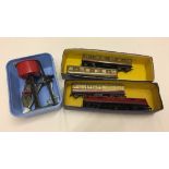 A collection of Hornby OO gauge tinplate railway items.