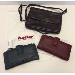 An aubergine leather over-body small bag and 2 leather purses by Hotter.