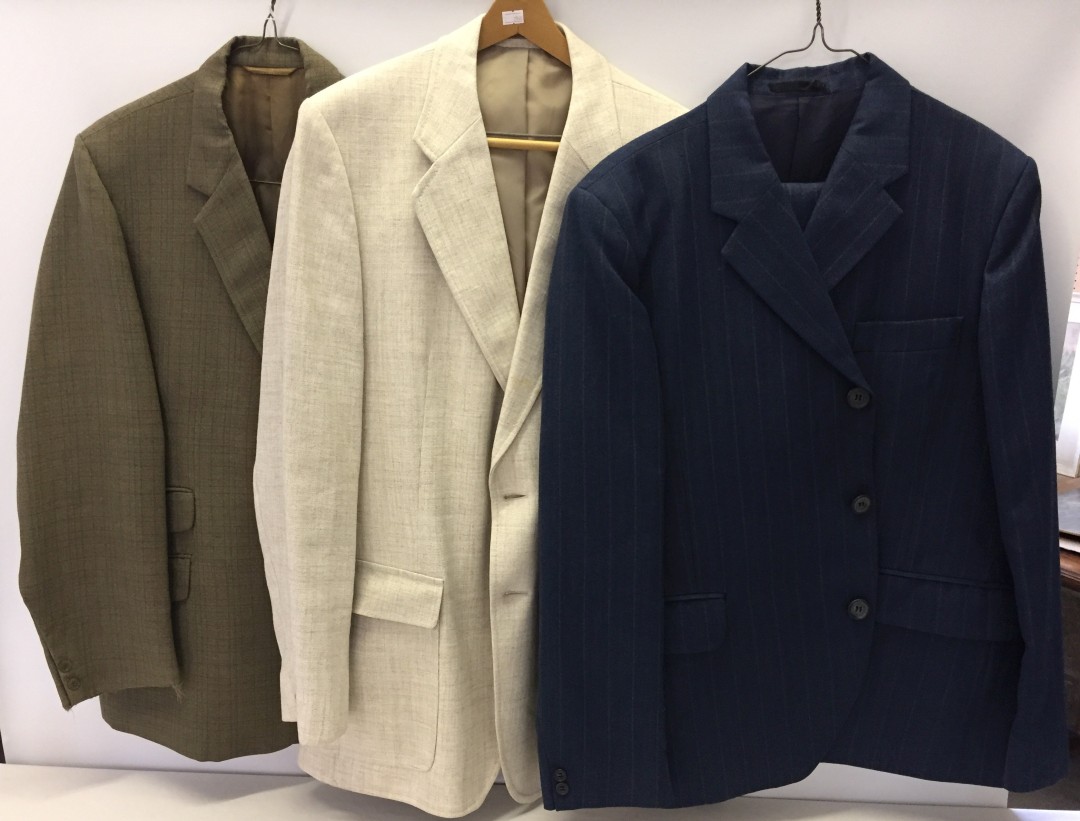 2 mens jackets together with a mens 2 piece suit in blue.